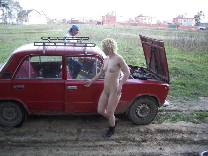 Naked short-haired blonde car and the broken car