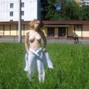 Russian curly blonde Emma takes off all her clothes in front of the audience on the street