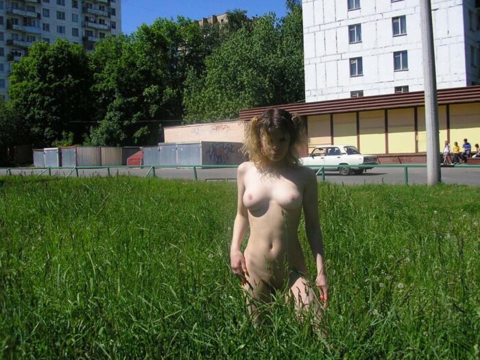 Russian curly blonde Emma takes off all her clothes in front of the audience on the street