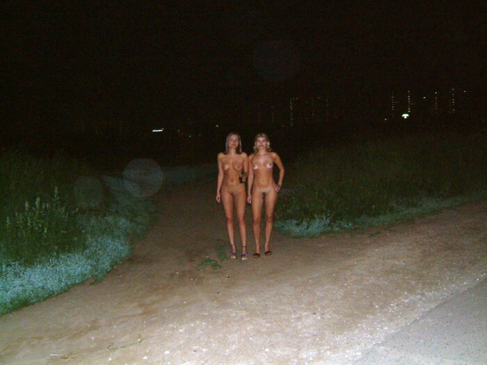 Two russian girls posing naked at public park at night