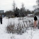 Young brunette Masha R walks naked in the snow in the city