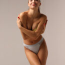 Santa enticingly removes her neon yellow leg warmer and brassiere and exposes her stiff nipples and bumtastic sexy body.