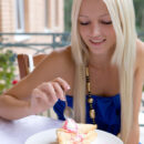 Blonde sweetheart Alysha A enjoys some sweet dessert before baring her sweet pussy.