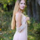 Hailey enchantingly strips off her sheer dress in the middle of the forest and flaunts her slim sexy body and hairless coochie.