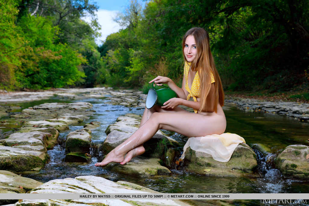 Hailey fetches water by the stream and divests her yellow polka dotted top and bares her bumtastic figure.