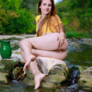 Hailey fetches water by the stream and divests her yellow polka dotted top and bares her bumtastic figure.