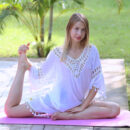 Dominica enjoys stretching her slender body, spreads her legs wide open as she bares her sweet pussy while doing yoga.