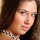 Zhanna B slips out of her blue dress and shows off her body