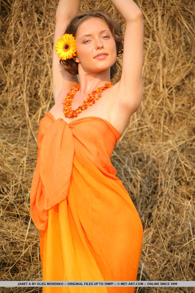 Janet A poses her tight body in an orange cover-up