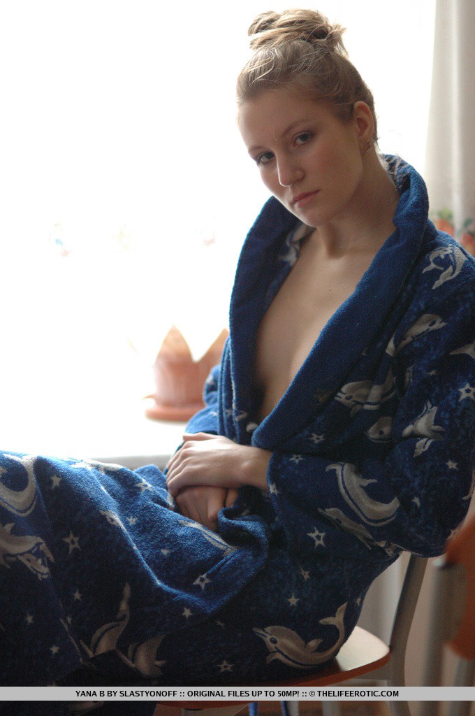 Yana’s blue robe slips slowly from her willowy body, soaking up the warm morning sunshine flooding the whole room from the window.