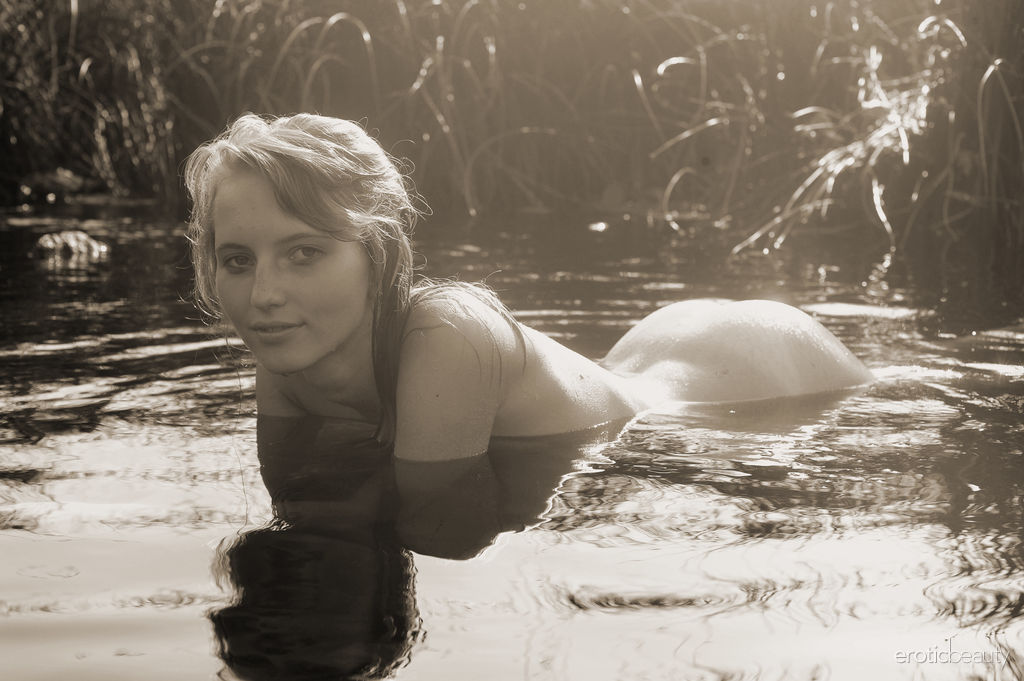 Eriska A takes off her bikini, swims in the pond and flaunts her  tan lines and juicy coconuts.