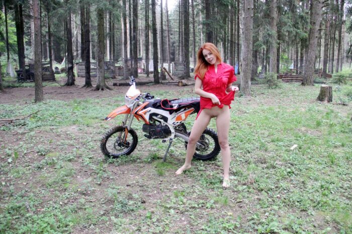 Russian red-haired girl Lera S with nice boobs posing on a motorcycle