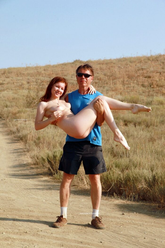 Redheaded young girl Renara spreads her legs in front of strangers