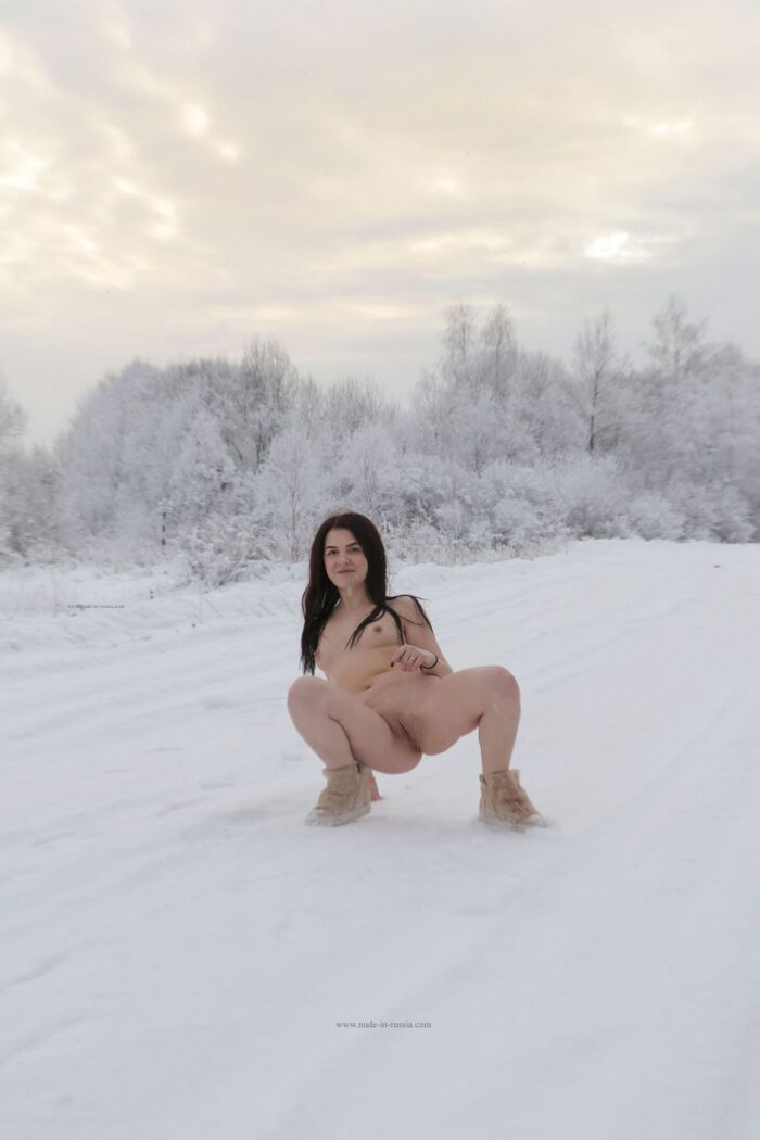 Russian brunette Alena M plays with a snow without clothes