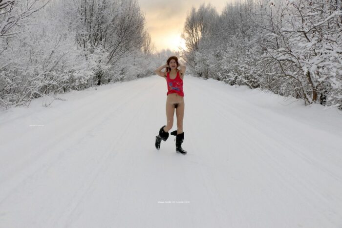 Russian girl Atisha who doesn`t like razor plays with snow