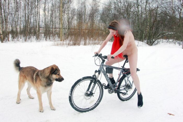 Russian young red-haired girl Alina S is trying to ride a bike