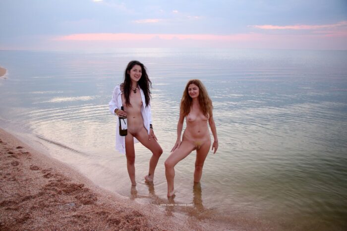 Two lovely girls posing at sea