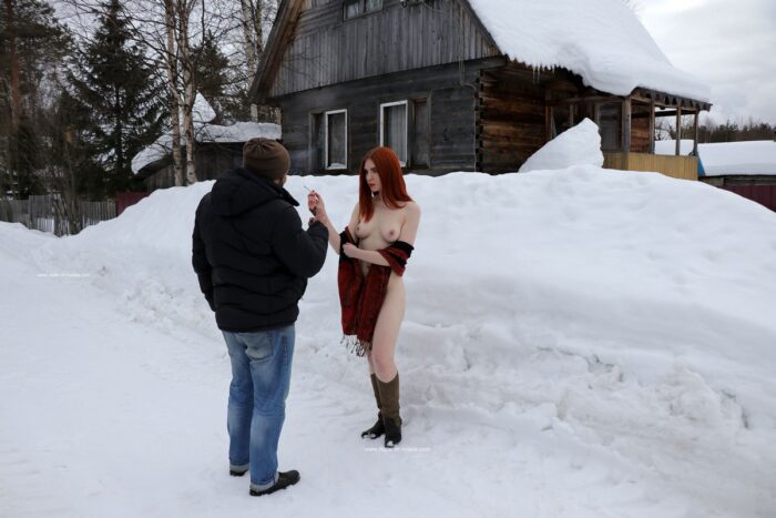 Beautiful redhead girl Tatjana E smokes with stranger on village road