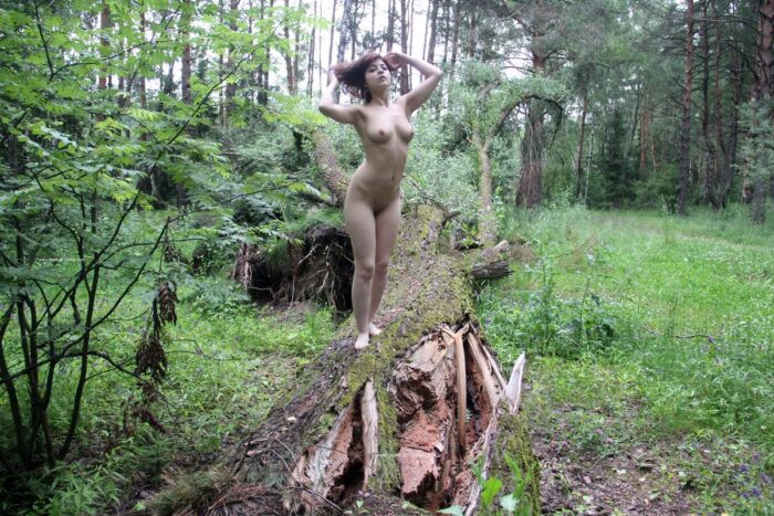 Red-haired girl Victoria G posing in the forest