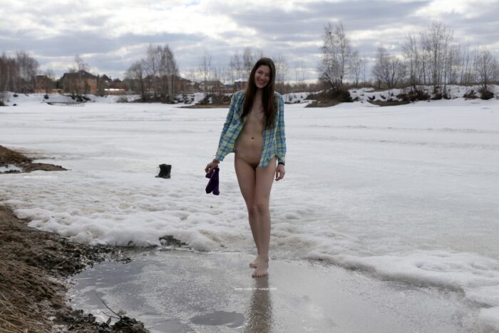 Young russian girl Katja P with small tits at frozen river