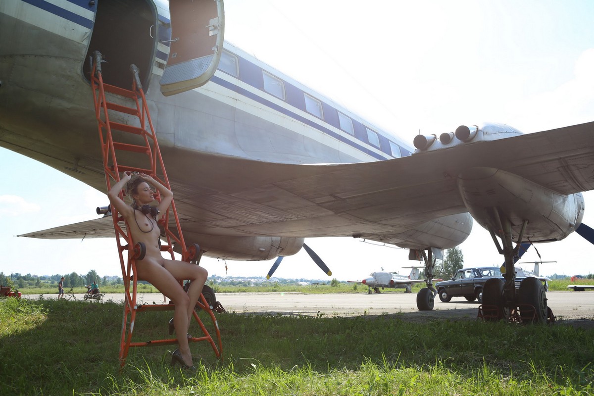 Russian blonde Sofa posing in an old plane