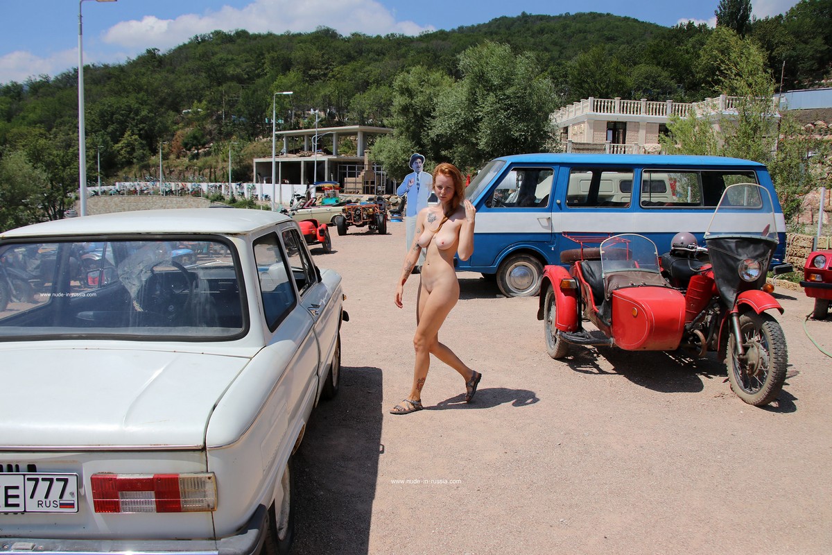 https://russiasexygirls.com/wp-content/uploads/2023/08/Redheaded-girl-Xenia-posing-in-outdoors-museum-of-old-cars-14.jpg
