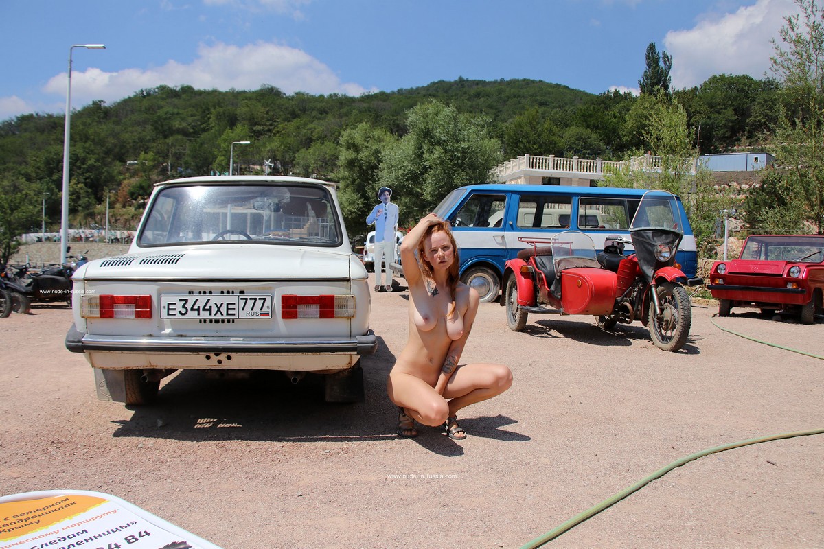 https://russiasexygirls.com/wp-content/uploads/2023/08/Redheaded-girl-Xenia-posing-in-outdoors-museum-of-old-cars-16.jpg