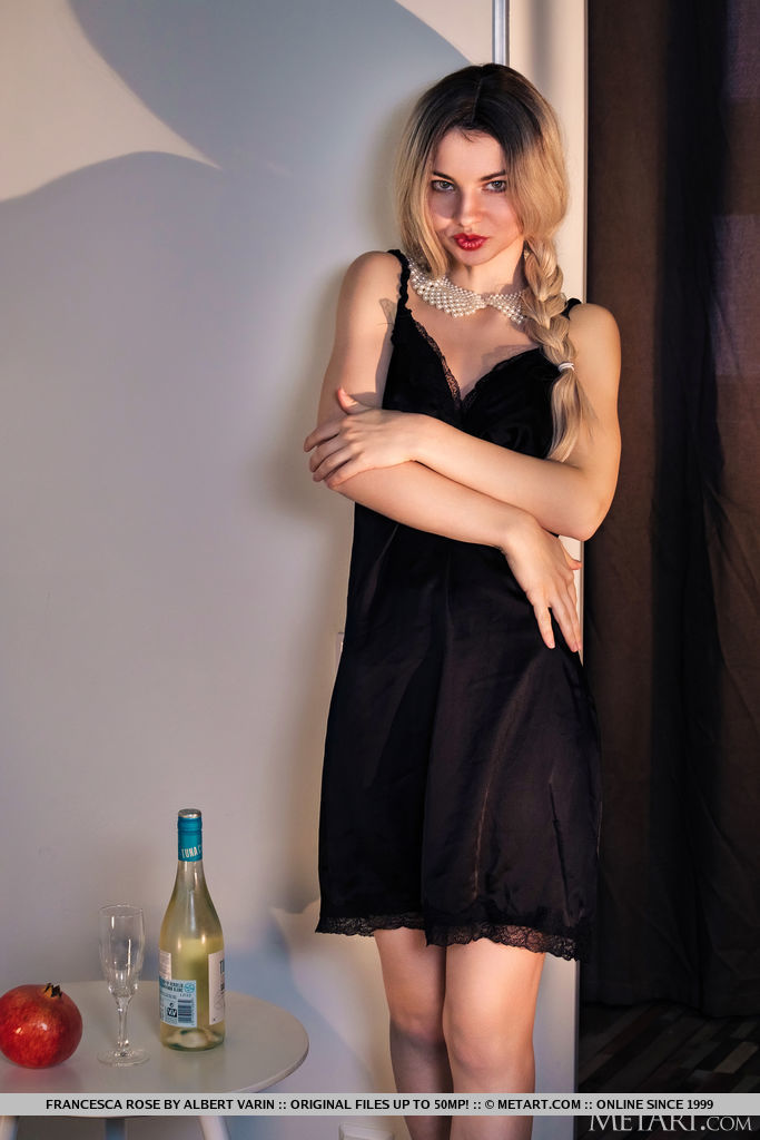 Francesca Rose seduces and teases with a red pouty lips, a bottle of wine and in her black silky nightie on the bed.