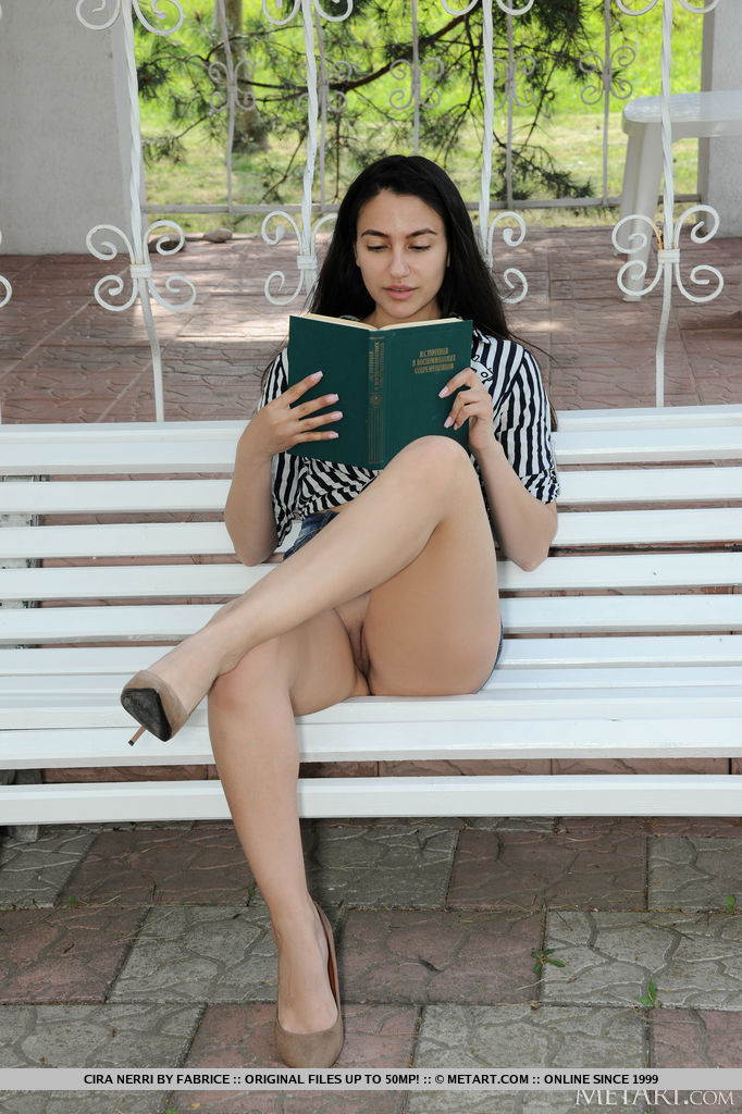 Sexy brunette Cira Nerri finds a secluded spot in the park where she can read her book, she parts her long legs, her short skirt rides up to reveal she's not wearing panties.