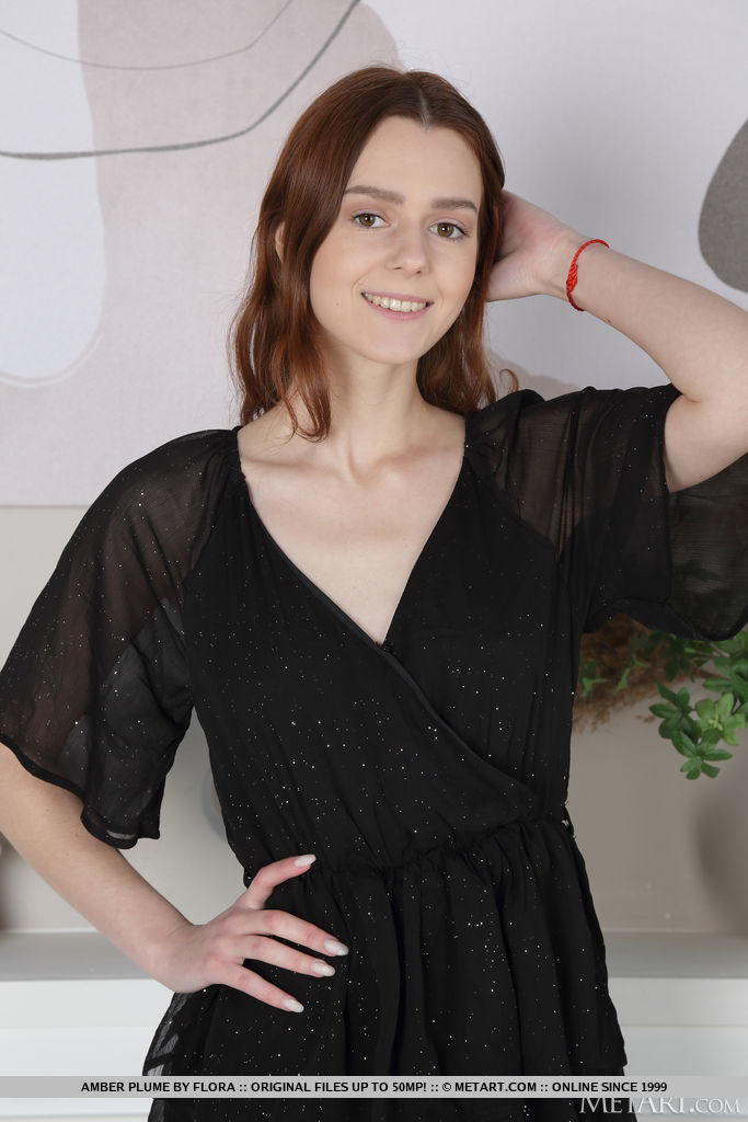 Sweet brunette Amber Plume looks adorable in her little black dress, then turns up the heat as she lifts it to reveal she's not wearing panties.