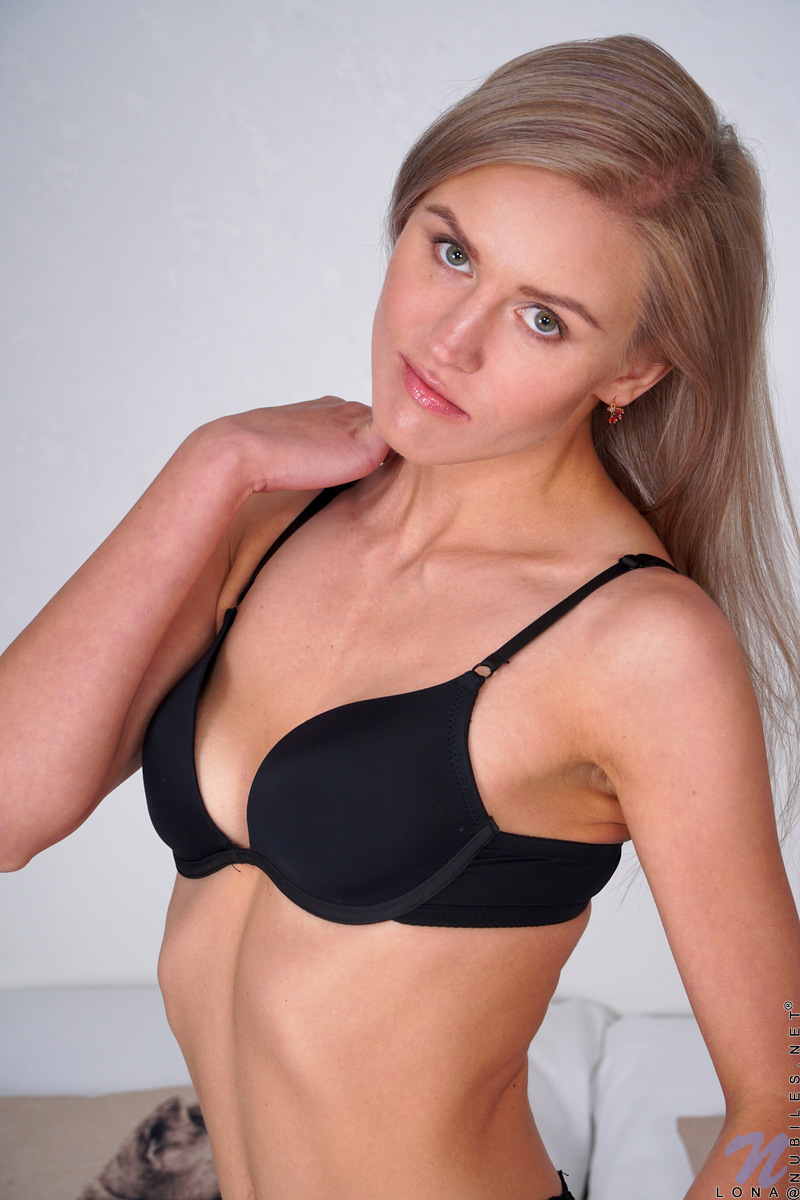 A black bra and panties highlight the slender delight of Lona's super skinny frame