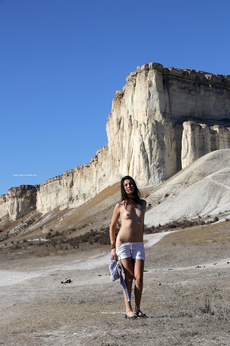 Small-breasted brunette Katja P walks completely naked near White Rock