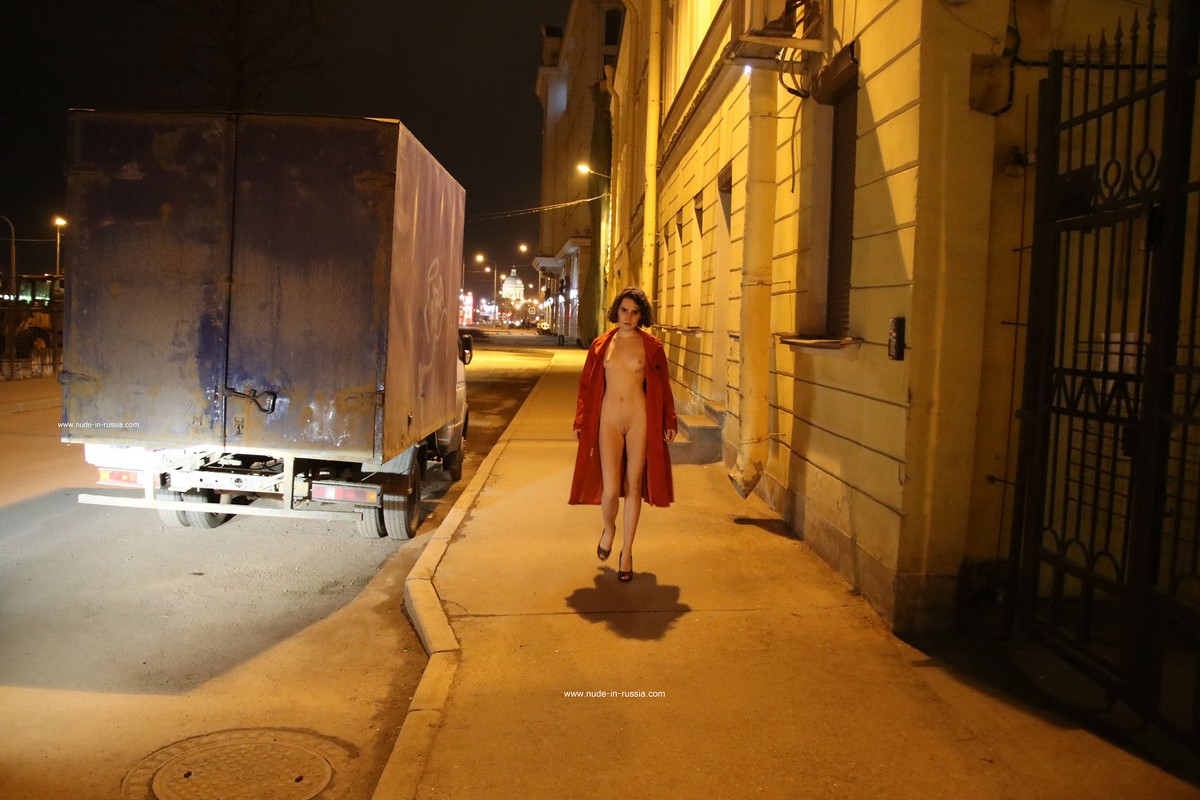 A slender Russian girl Diana T shows her body on the night streets of St. Petersburg