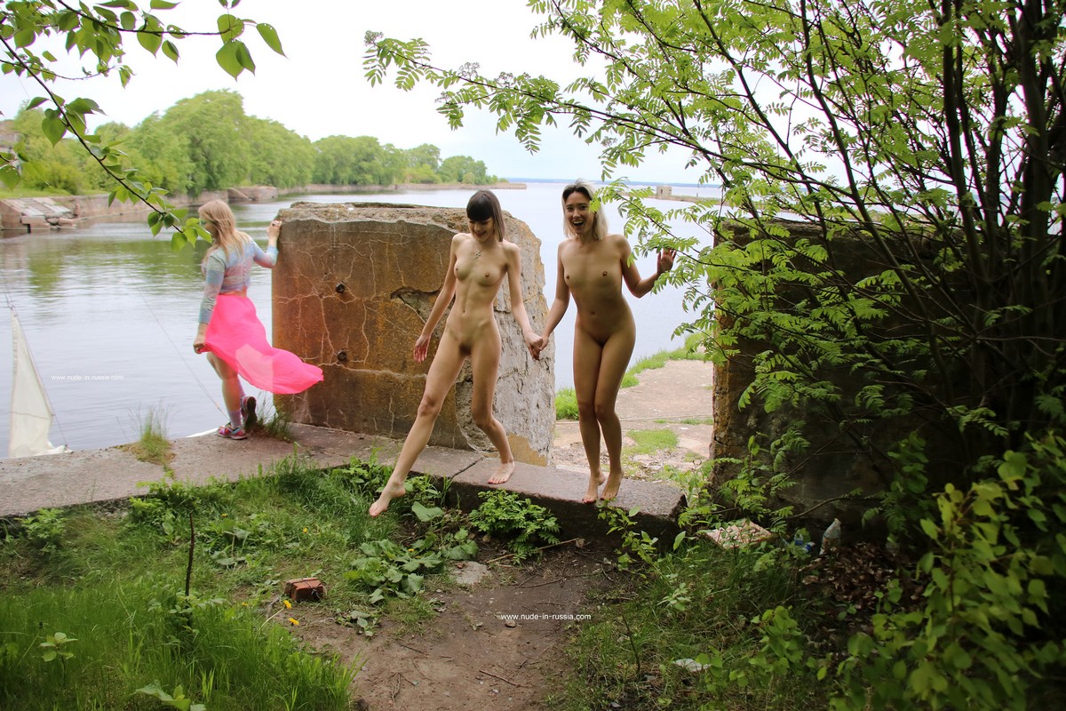 Two young girls undress on a yacht near the old fort