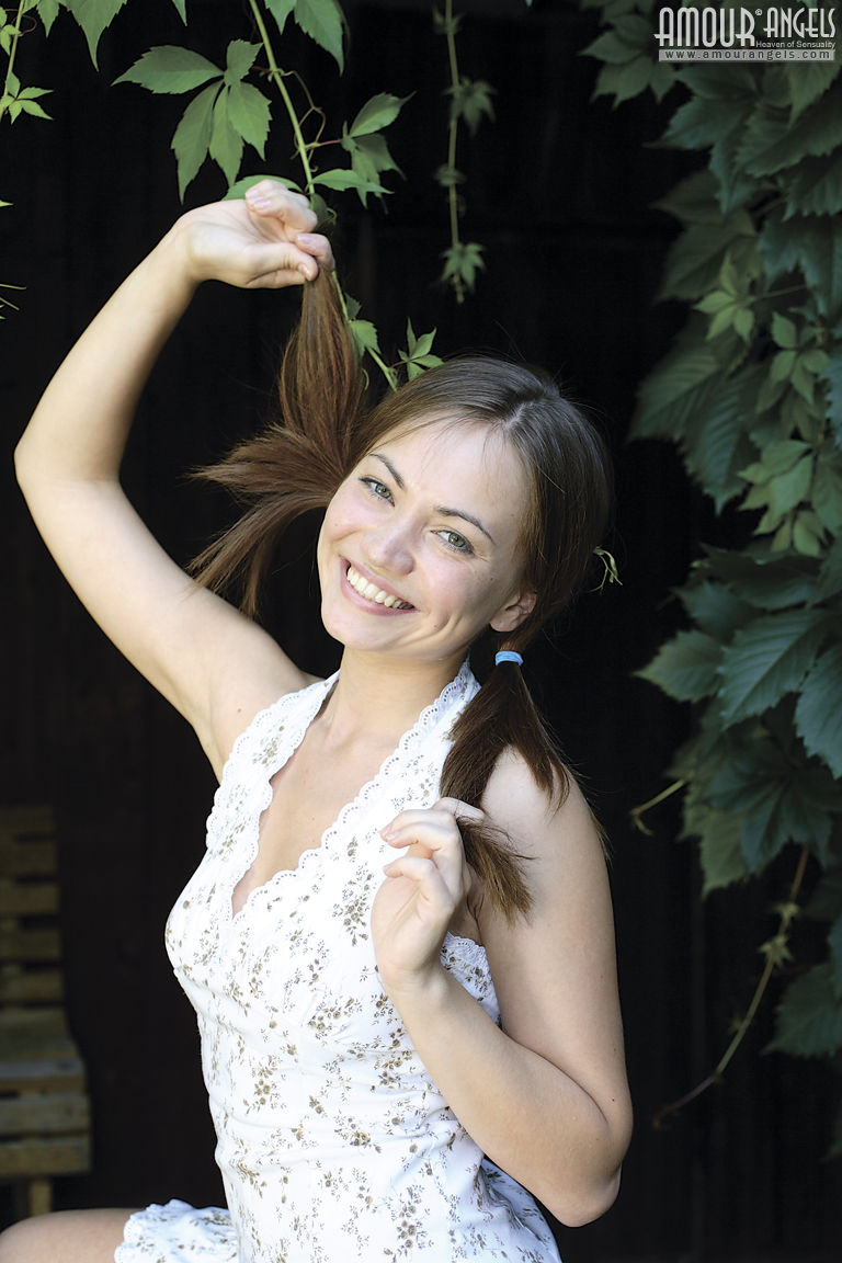 Yuliya: SLY GIRL. Teen on wooden stairs