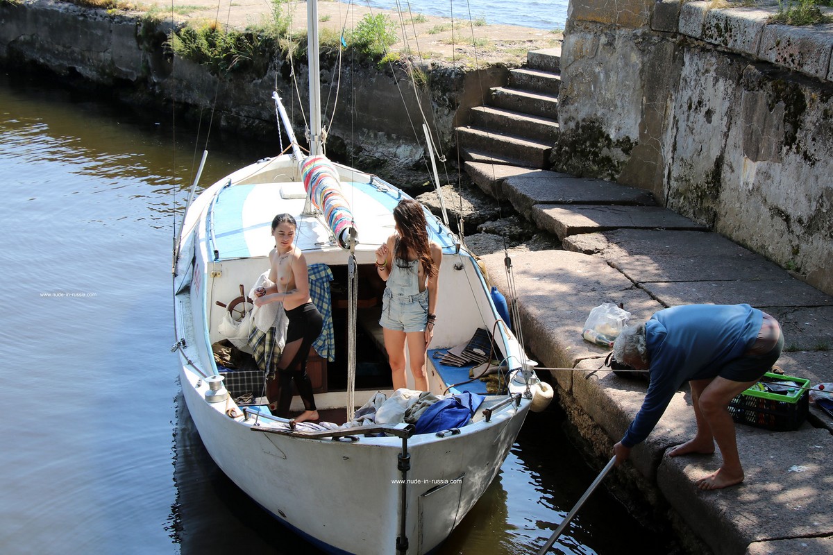 Two young girls take off their panties in an old fort