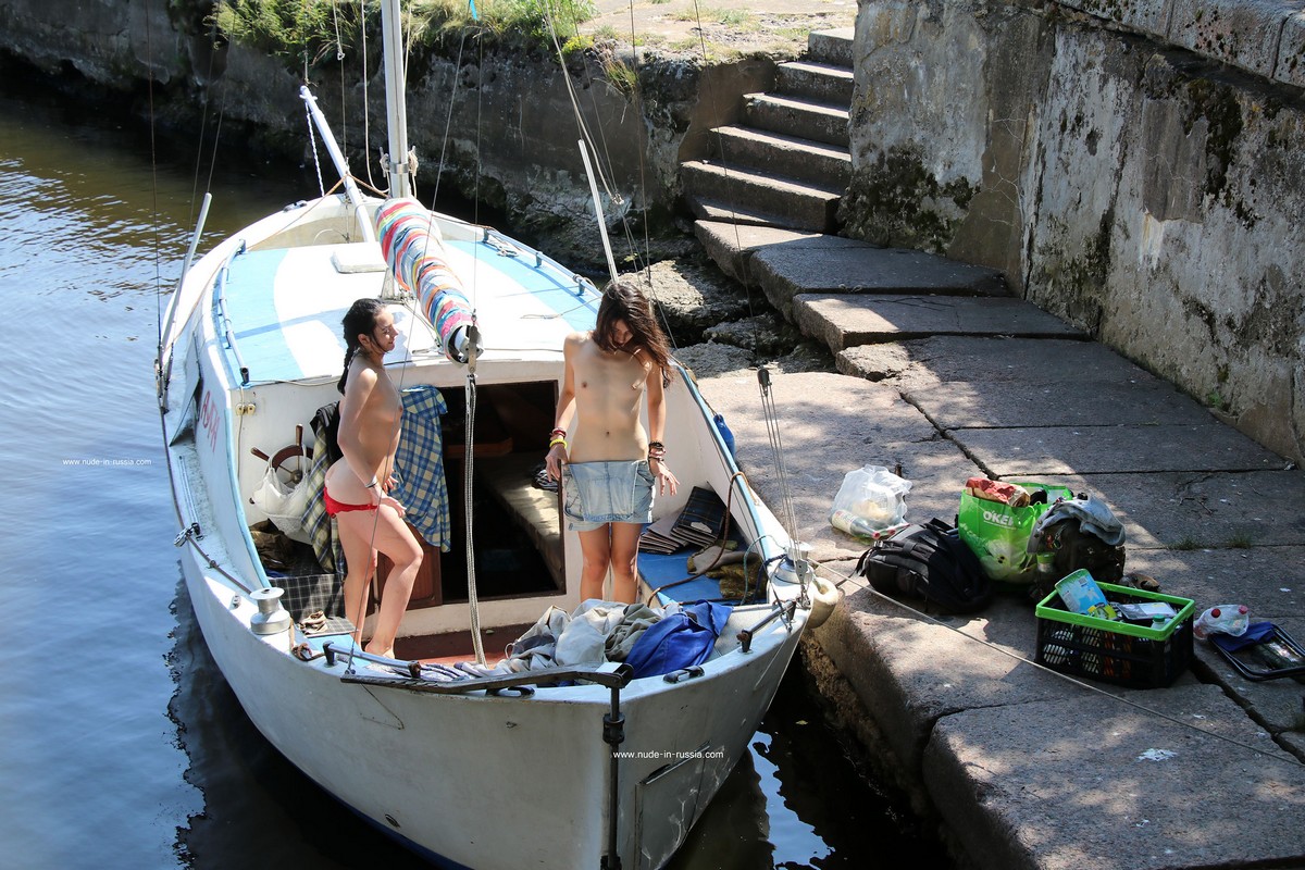 Two young girls take off their panties in an old fort