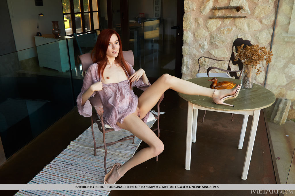 Beautiful red haired Sherice strip naked on the chair and uncover her petite sexy figure and hairless pussy.