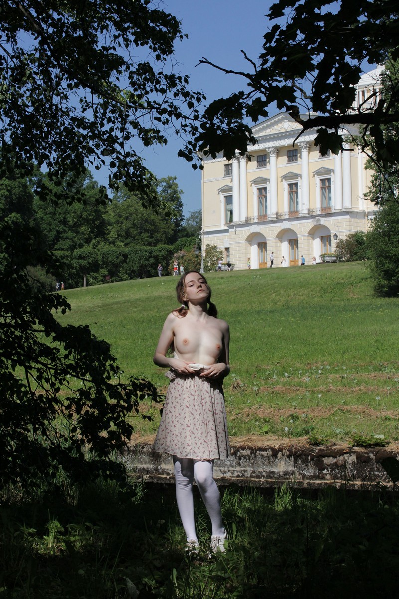 Cute girl Anna without clothes walking in the park