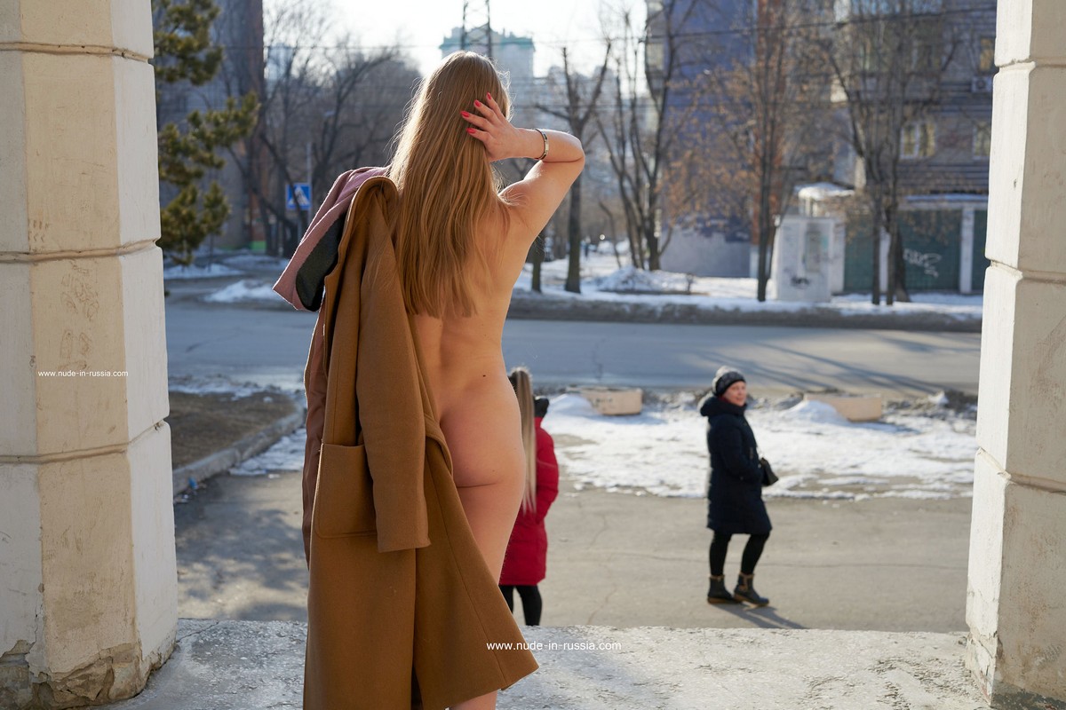 Long haired Nikol with small tits shows herself on the street