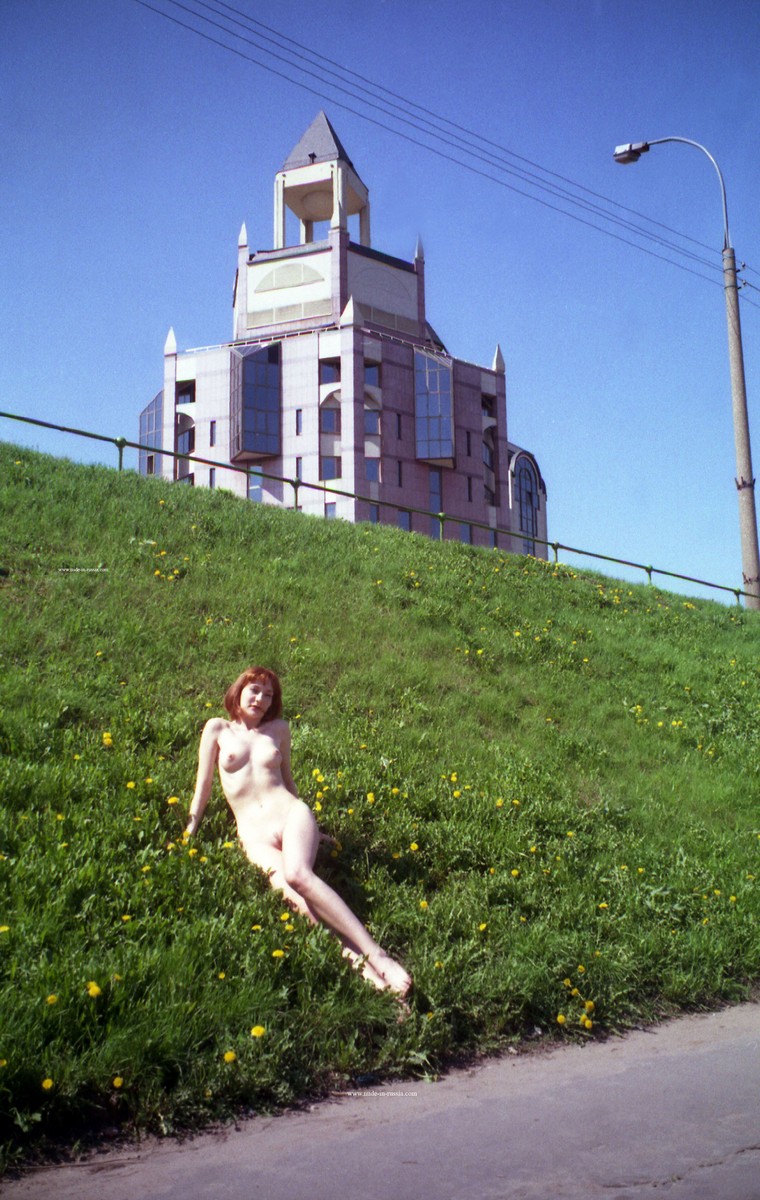 Old photos of a redhead walking along the city embankment