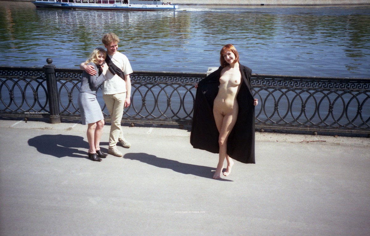 Old photos of a redhead walking along the city embankment