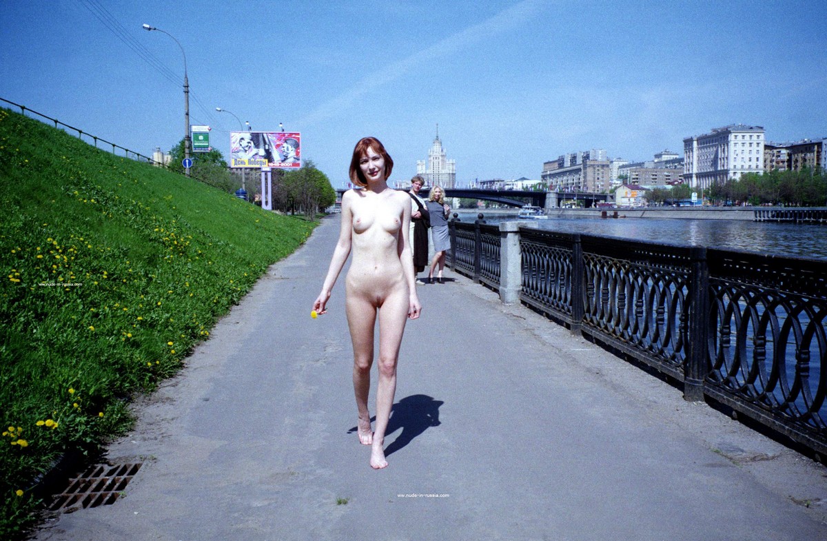 Old photos of a redhead walking along the city embankment