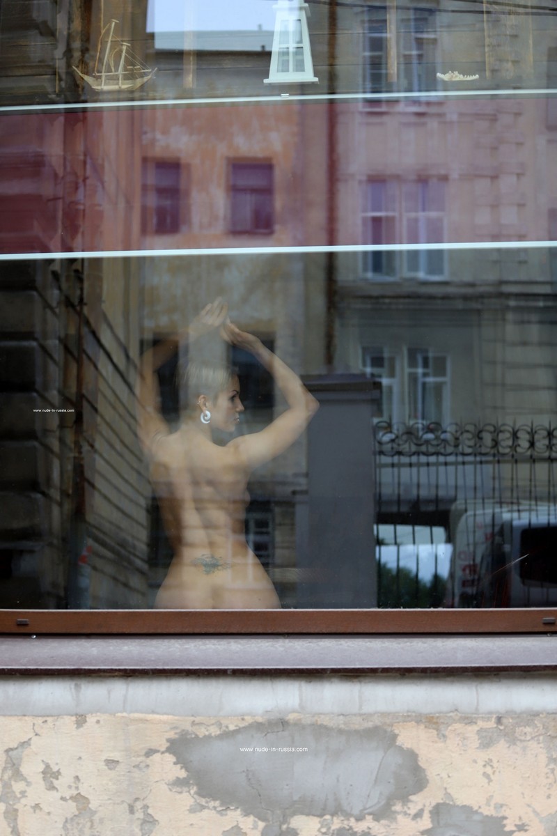 Photoshoot in a window on a busy street