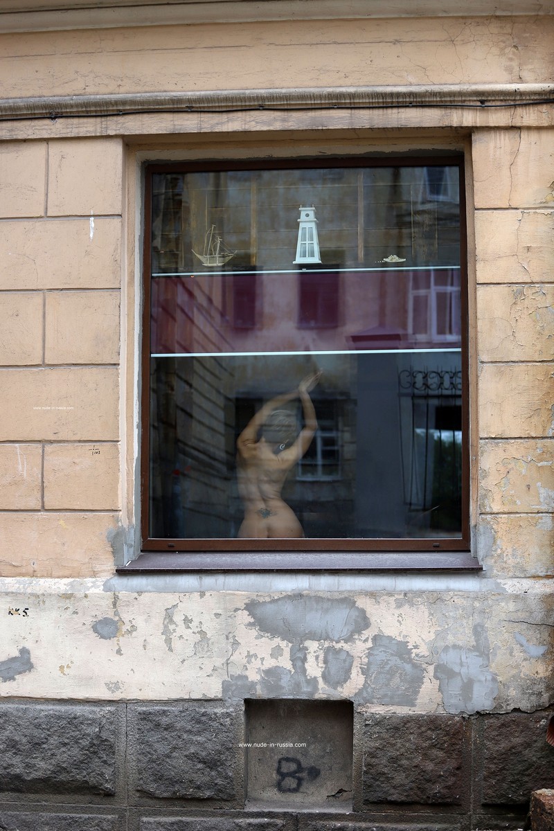 Photoshoot in a window on a busy street