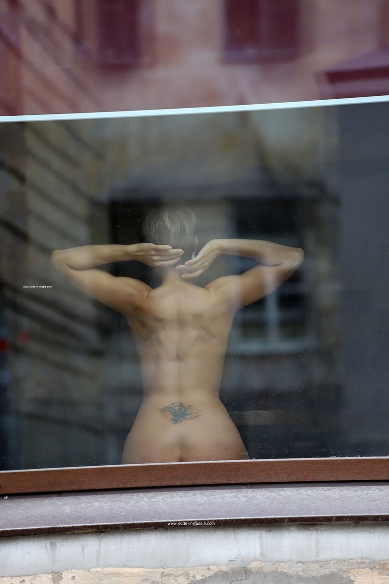 Photoshoot in a window on a busy street