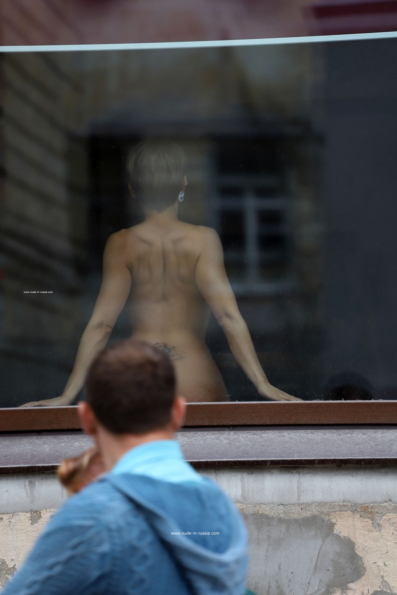 Photoshoot in a window on a busy street