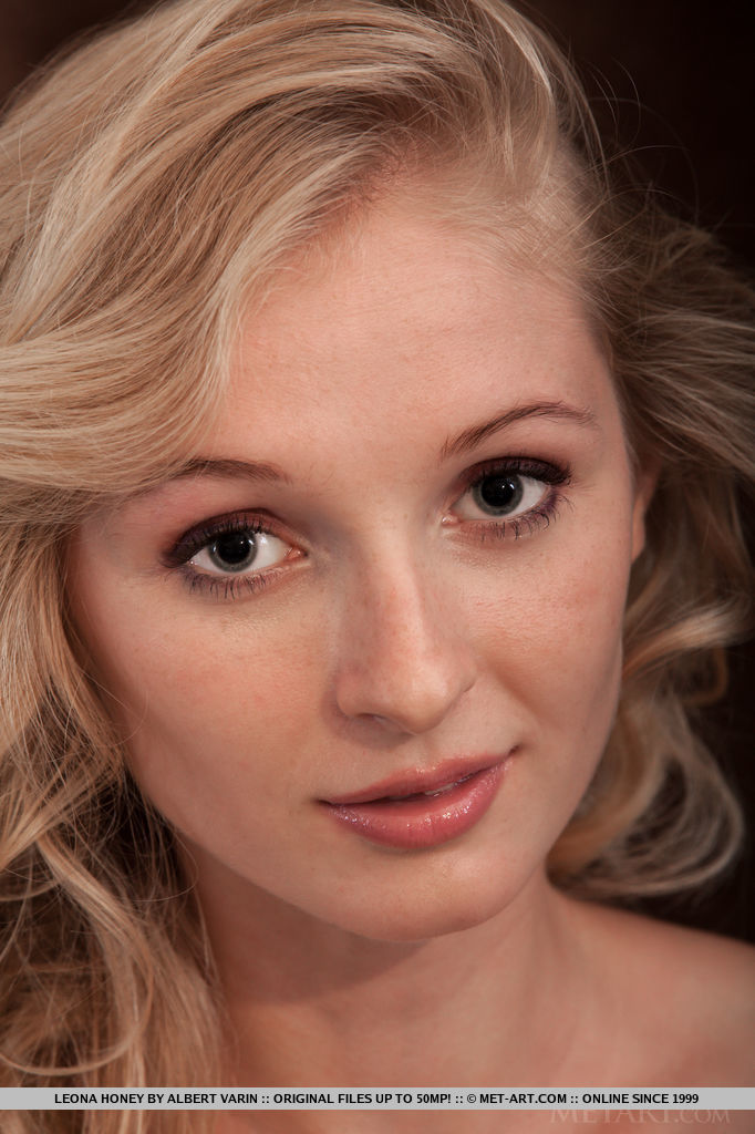 An elegant beauty named Leona Honey poses for the first time in Metart, showcasing her slim and tight body.