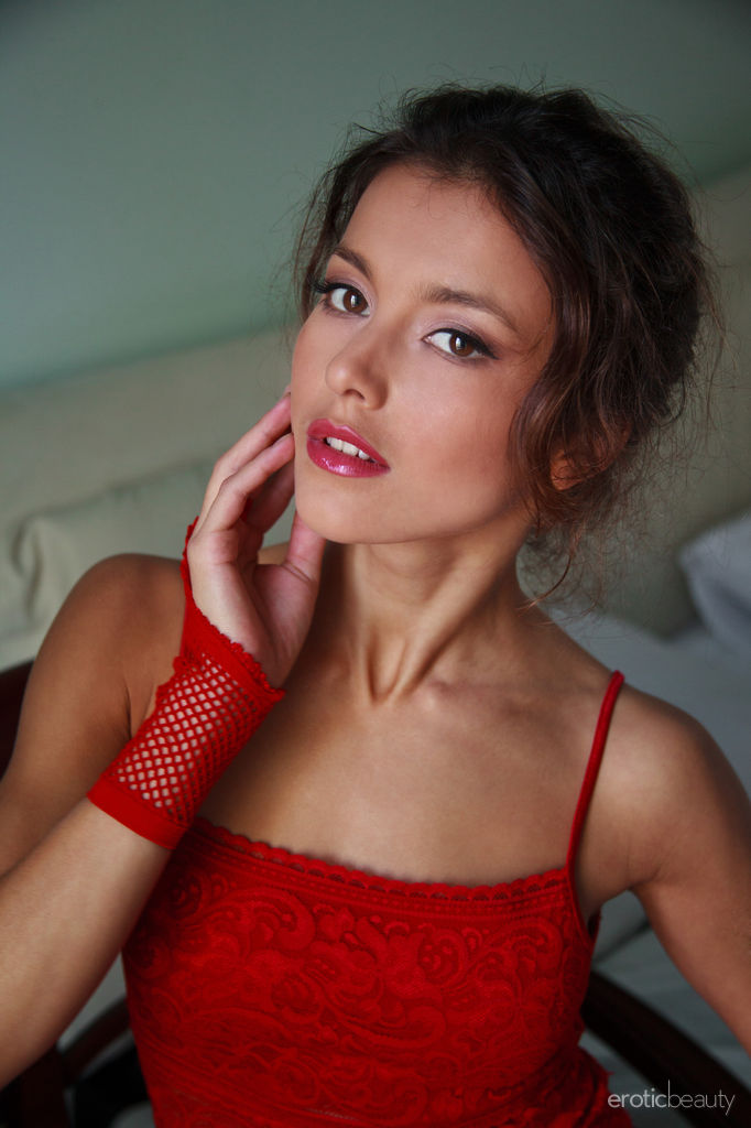 Marvel at Divina A as she shows off her perfect body in hot red lingerie as she spreads herself wide open for you to see.