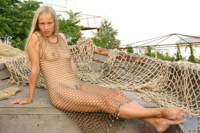 Only wearing a see thru net dress ljuba looks absolutely beautiful